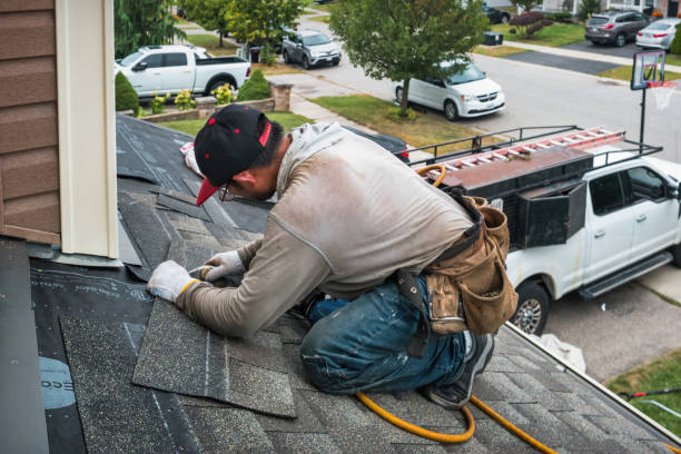 Professional Flat Roof Repair technician working in Highland, WI